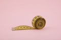 Tailor measuring tape on pink background Royalty Free Stock Photo
