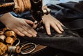 Tailor`s hands close-up sew clothes on an old retro sewing machine. Tools for a tailor, fashion designer or seamstress Royalty Free Stock Photo