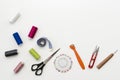 Tailor`s work desk. Pattern of sewing accessories and tools on white background top view copyspace Royalty Free Stock Photo