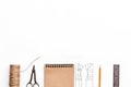 Tailor`s work desk. Pattern of clothing and tools on white background top view copyspace