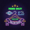 Tailor shop neon design or emblem. Vector. Night neon signboard. Vintage typography design with sewing machine, hangers