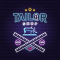 Tailor shop neon design or emblem. Vector. Night neon signboard. Vintage typography design with sewing machine, measure