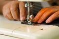 Tailor work in a sewing machine, close up of needle and thread