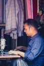 Tailor working in his tiny shop in Nepal