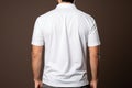 Tailored style rear view of mens white polo, embodying smart and relaxed professionalism