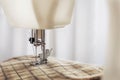 Tailoring process - sewing machine with needle, thread and fabric. Item of clothing Royalty Free Stock Photo