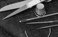 Tailoring scissors, needles and textile close-up