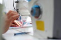 Tailoring. Sewing room, seamstress sews clothes on a sewing machine