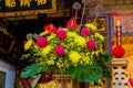 Tainan, Taiwan, Asia, October 12, 2019 Multicolored bouquet with yellow chrysanthemums at the altar in a Taiwanese temple