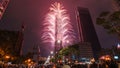 Taipei City Night landscape and Taipei 101 skyscraper is lit up by fireworks. People watching and taking photos and videos. Royalty Free Stock Photo