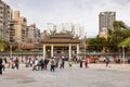 Daytime shot of many people visiting Lungshan Temple