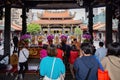 Daytime shot of many people visiting Lungshan Temple