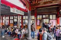 Daytime shot of many people visiting Lungshan Temple