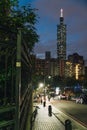 Taipei 101 Skyscraper at night with road and people near Xiangshan Elephant Mountain in Taipei, Taiwan Royalty Free Stock Photo