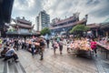 Taipei, Taiwan - circa September 2015: People pray and do offerings in Longshan Buddhist temple in Taipei city, Taiwan Royalty Free Stock Photo