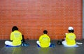 Taipei, Taiwan - May 7, 2017 : member of Falun Gong wear a yellow shirt sitting and reading a scripture