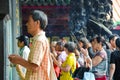 Taipei Taiwan - May 13th 2017: Older Asian man with Buddhist incense sticks praying in Longshan Temple. Religious ritual, ceremony Royalty Free Stock Photo
