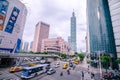 View of a busy street corner in Downtown Taipei City at rush hour with cars & buses dashing by, Royalty Free Stock Photo