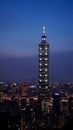 Taipei 101 tower standing in the middle of the city. A view of the tallest building in Taiwan during night time. Royalty Free Stock Photo