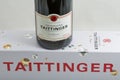 Taittinger champagne bottle and box closeup against white Royalty Free Stock Photo