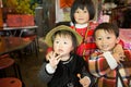 Taiwanese indigenous siblings pose in front the camera