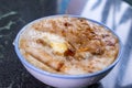 Taiwan`s distinctive famous snacks: Savory rice pudding Wa gui in a white bowl on stone table, Taiwan Delicacies