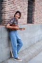 Taiwanese guy smiling and playing acoustic Ukulele guitar. Royalty Free Stock Photo