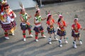Taiwanese dancing group in garb of Amis Tribe from Hualien with headdress and skirt, Kaohsiung, Taiwan