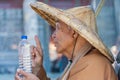 Taiwanese monk at the Wenwu temple blessing a bottle of water Royalty Free Stock Photo