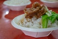 Taiwanese pork knuckle rice food on paper cup at taiwan night market in Taipei, Taiwan.