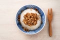 Taiwanese savory rice pudding Wa gui with chopped dried radish and soy sauce