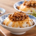 Taiwanese savory rice pudding Wa gui with chopped dried radish and soy sauce