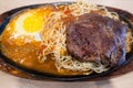 Taiwanese style sizzling steak with noodles and egg in traditional night market