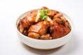 Taiwanese traditional food pork knuckle in a white bowl with golden line for Chinese Lunar New Year meal