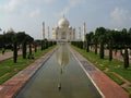 White marble mausoleum surrounded by gardens, fountains and four minarets. Taj Mahal