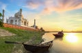Taj Mahal Agra at sunset with wooden boats on the banks of river Yamuna Royalty Free Stock Photo