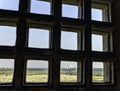 Taj Mahal behind bars - panoramic view of fields with Taj Mahal in background from Agra Red Fort Royalty Free Stock Photo