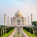 Taj Mahal front view reflected on the reflection pool.