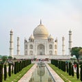 Taj Mahal front view reflected on the reflection pool.