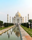 Taj Mahal front view reflected on the reflection pool.