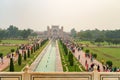 Taj Mahal gardens with fountains,on background the main gateway (darwaza), Agra, Uttar Pradesh, India