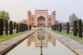 Taj Mahal gate reflected in pool, India