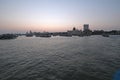 Taj Mahal hotel, Gateway of India and tourist boats in water of Arabian Sea on sunset in Mumbai Royalty Free Stock Photo