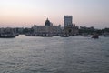 Taj Mahal hotel, Gateway of India and tourist boats in water of Arabian Sea on sunset in Mumbai Royalty Free Stock Photo