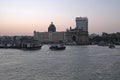 Taj Mahal hotel, Gateway of India and tourist boats in water of Arabian Sea on sunset in Mumbai Royalty Free Stock Photo