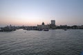 Taj Mahal hotel, Gateway of India and tourist boats in water of Arabian Sea on sunset in Mumbai