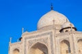 Taj Mahal in India under blue sky with the inscription of the coran in arabic letter meaning in english: This is an invitation to