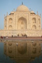 The Taj Mahal main building and its reflect in a water tank.