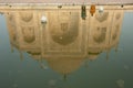 The Taj Mahal main building reflected in a water tank.