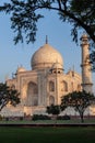 Taj Mahal in morning light with the inscription of the coran in arabic letter meaning in english: This is an invitation to live on